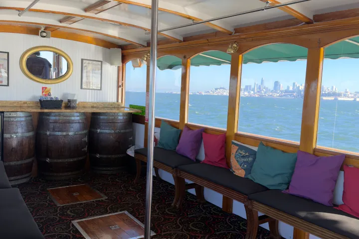 Wine Therapy 1958 wooden yacht interior cabin with panoramic windows overlooking San Francisco Bay